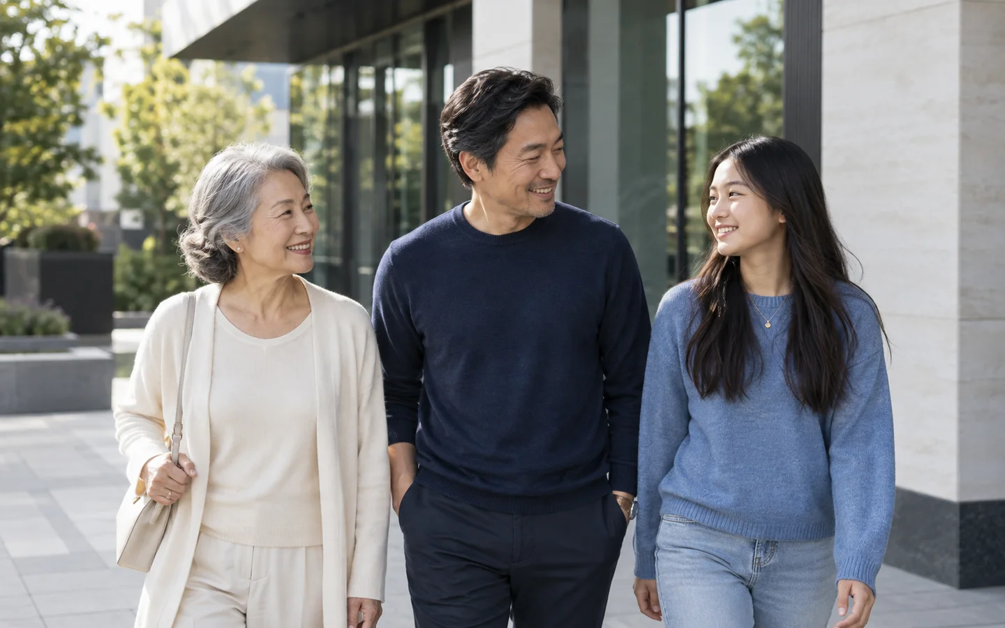 Family walking together near modern architecture