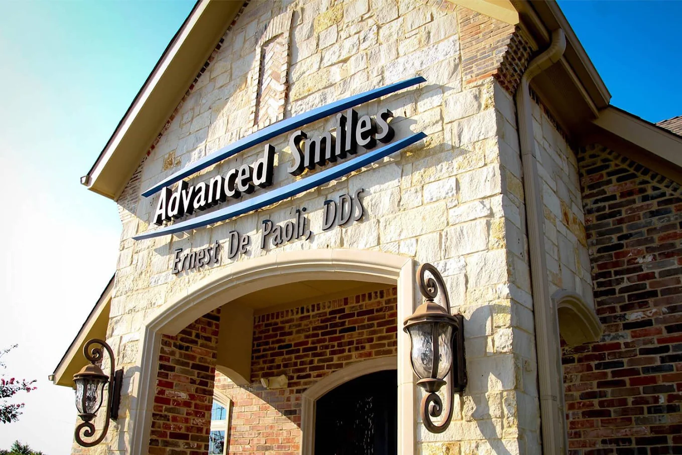Advanced Smiles sign above the office entrance